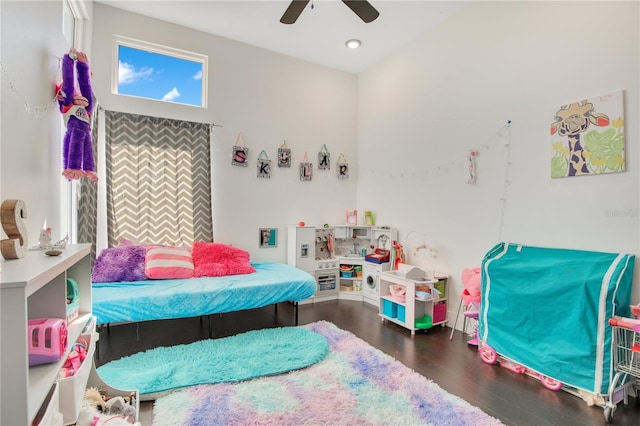 bedroom with a ceiling fan and wood finished floors