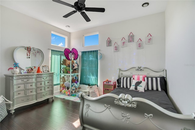 bedroom featuring a ceiling fan and dark wood-style flooring