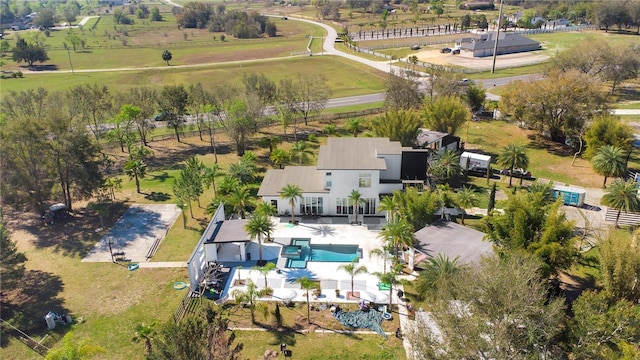 birds eye view of property with a rural view