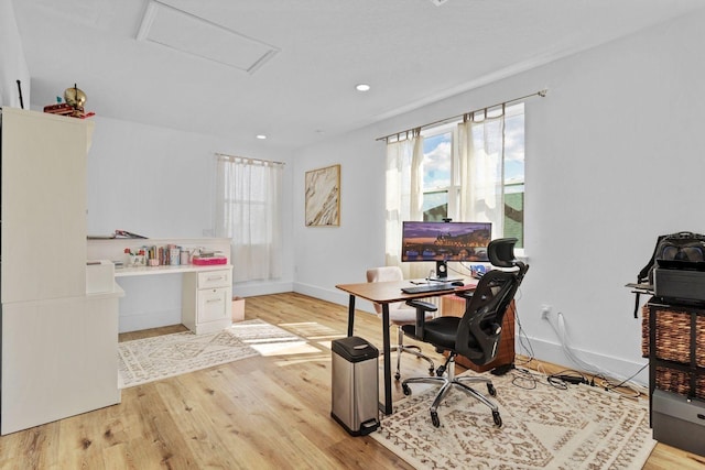 home office with light wood finished floors, attic access, baseboards, and recessed lighting