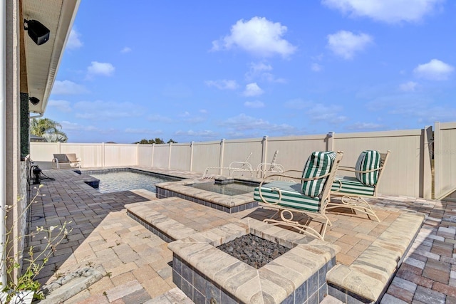 view of patio with a fire pit and a fenced backyard