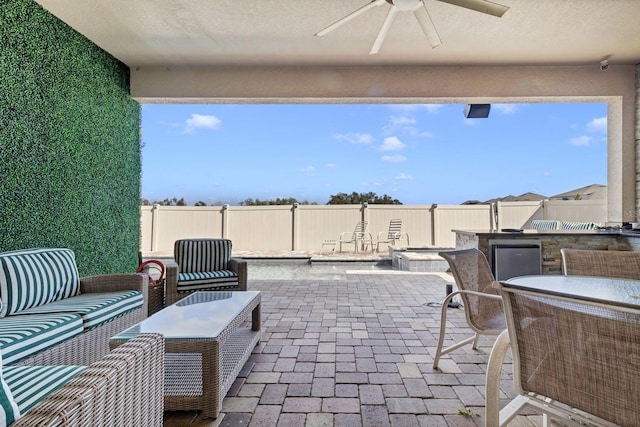 view of patio / terrace featuring a fenced backyard and a ceiling fan