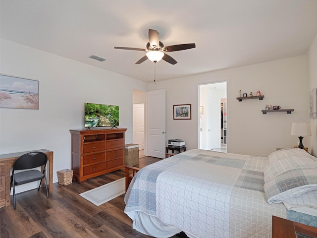 bedroom with dark wood-type flooring, visible vents, and a ceiling fan