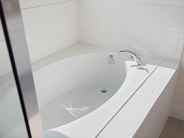 bathroom with a garden tub