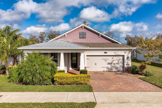 view of front of property featuring a garage