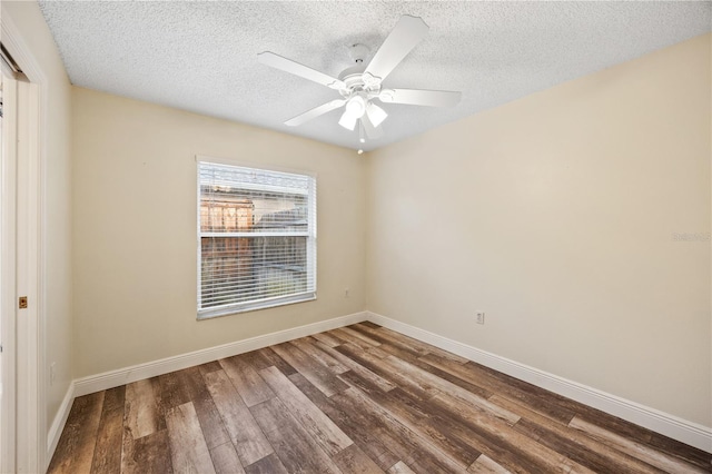 unfurnished room featuring dark wood-type flooring, ceiling fan, and a textured ceiling