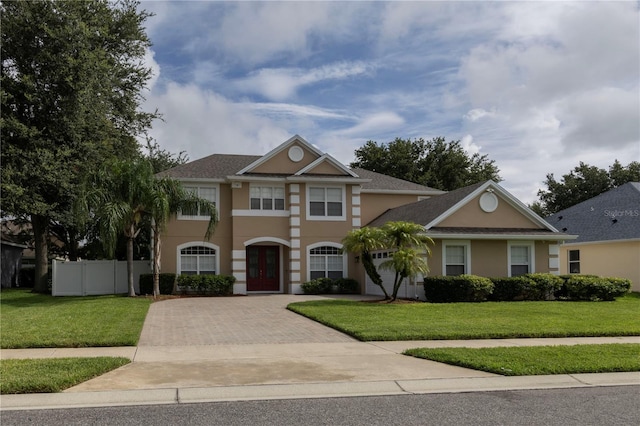 view of front of house featuring french doors and a front lawn