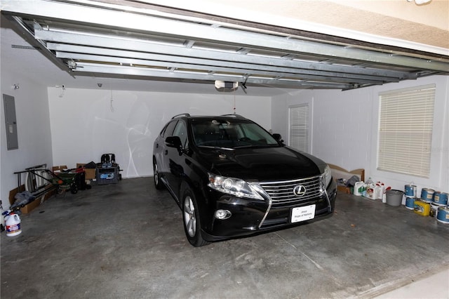 garage featuring a garage door opener and electric panel