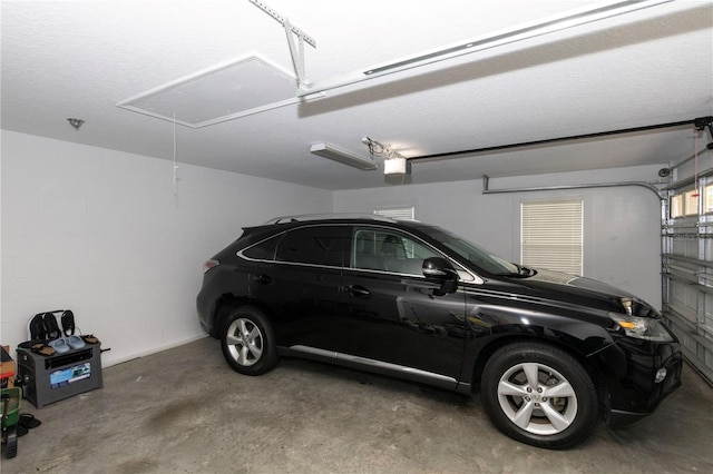 garage featuring a garage door opener