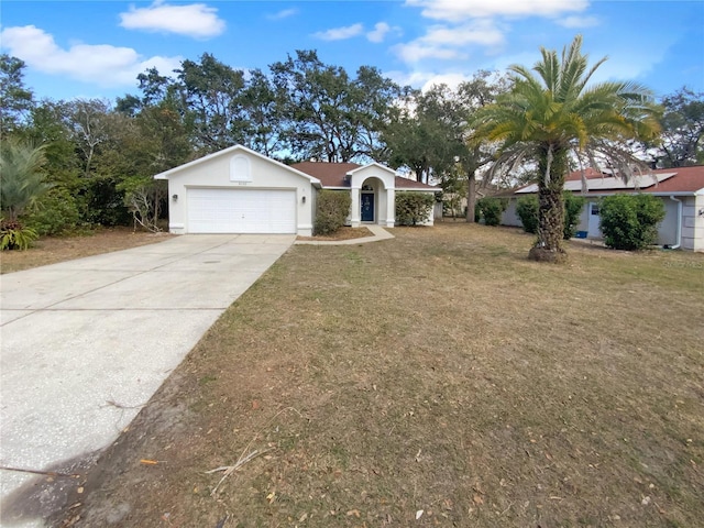 single story home featuring a garage, driveway, a front yard, and stucco siding