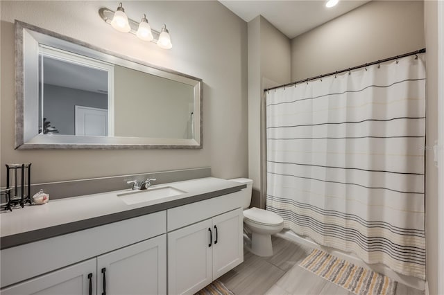 7515 John Hancock Dr, Winter Garden, FL 34787 - full bathroom with toilet, vanity, a shower with shower curtain, and recessed lighting