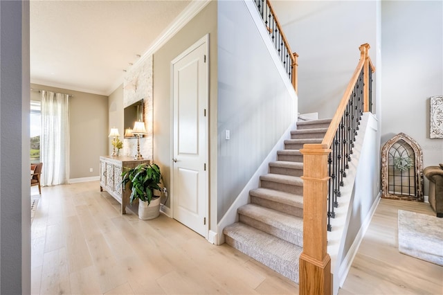7515 John Hancock Dr, Winter Garden, FL 34787 - stairs featuring baseboards, ornamental molding, and wood finished floors
