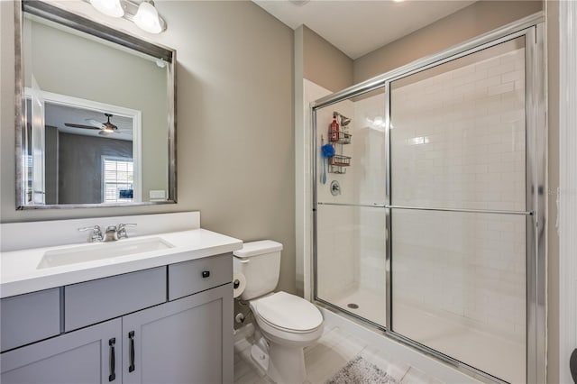 7515 John Hancock Dr, Winter Garden, FL 34787 - full bathroom with vanity, tile patterned flooring, a ceiling fan, toilet, and a shower stall