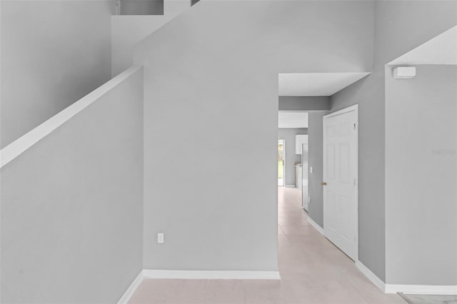 hallway featuring baseboards