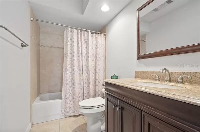 full bathroom featuring visible vents, toilet, vanity, shower / bath combo with shower curtain, and tile patterned flooring