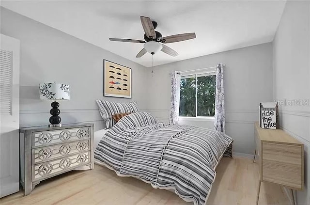 bedroom featuring light wood finished floors and ceiling fan