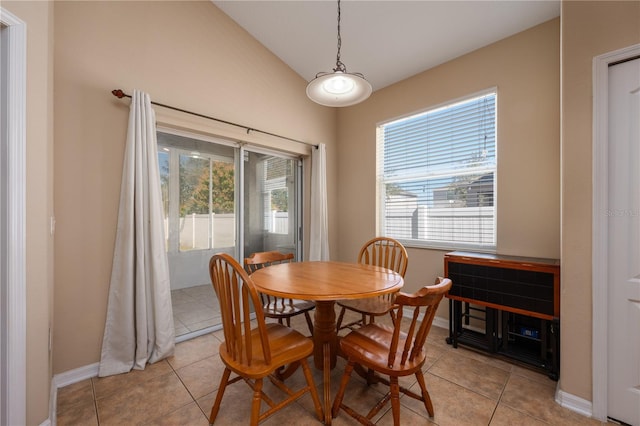 dining area featuring baseboards and light tile patterned flooring