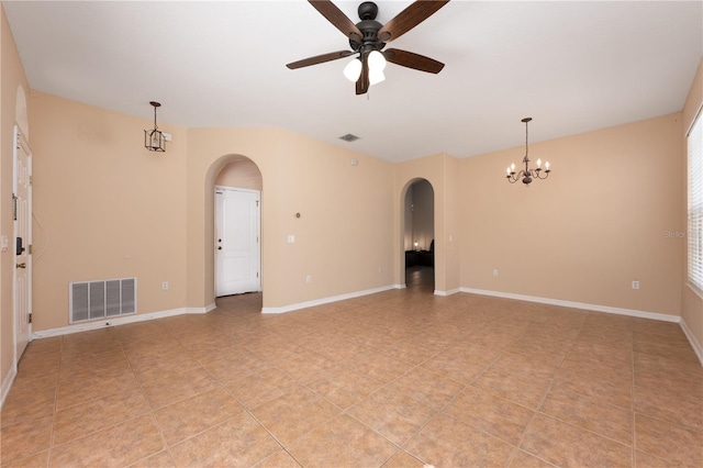 unfurnished room featuring arched walkways, visible vents, baseboards, and ceiling fan with notable chandelier