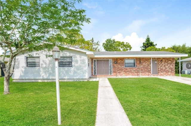 single story home featuring a front lawn