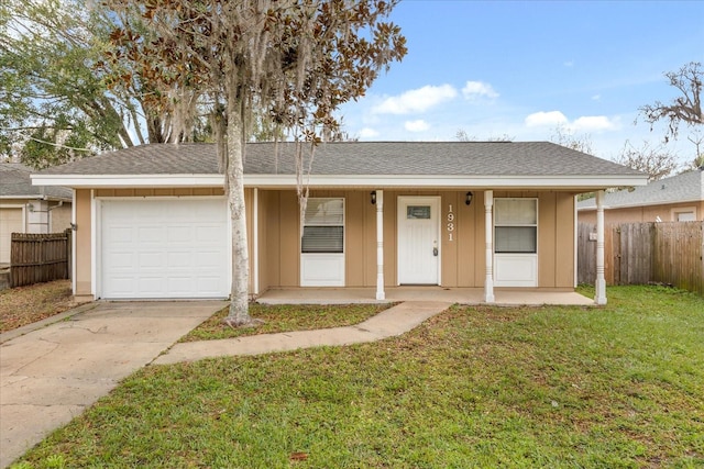 view of front of house featuring a garage, a front lawn, driveway, and board and batten siding