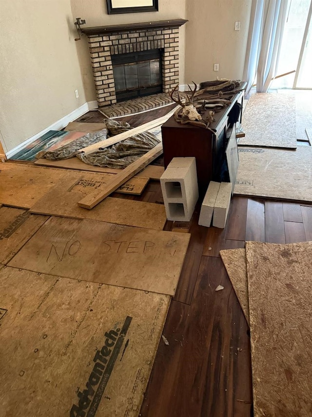 kitchen featuring dark hardwood / wood-style floors and a fireplace