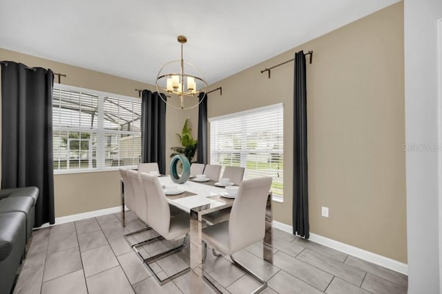 9017 Dogleg Dr, Davenport, FL 33896 - dining room with light tile patterned floors, a notable chandelier, and baseboards