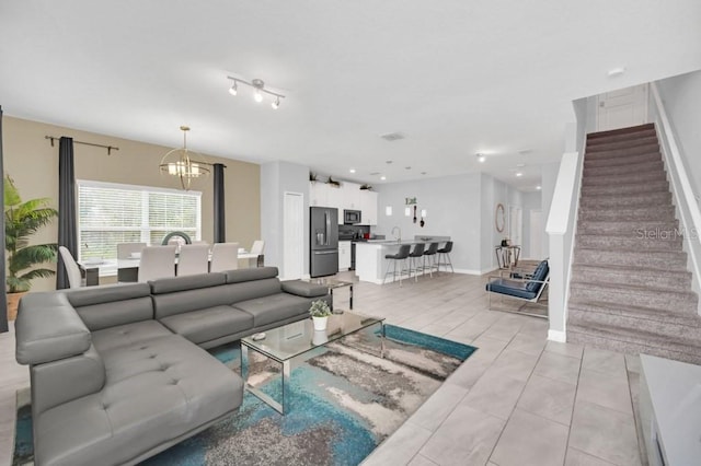 9017 Dogleg Dr, Davenport, FL 33896 - living room with baseboards, a chandelier, stairs, light tile patterned floors, and recessed lighting