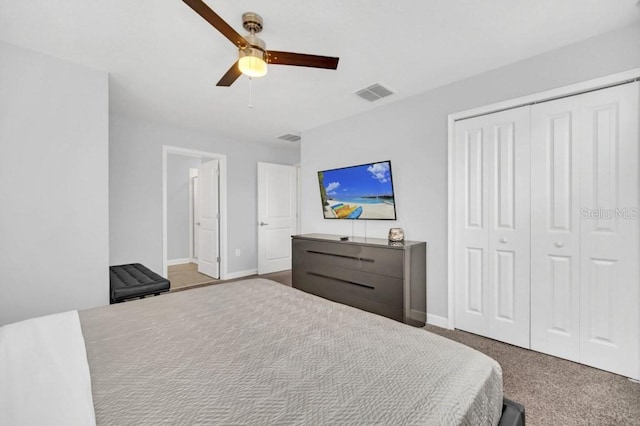 9017 Dogleg Dr, Davenport, FL 33896 - carpeted bedroom with a closet, visible vents, baseboards, and a ceiling fan