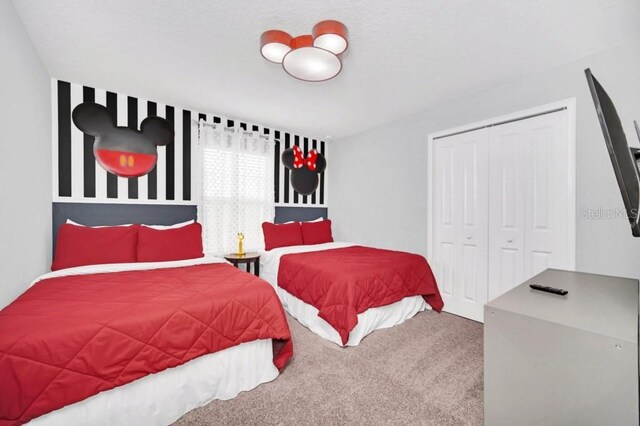 9017 Dogleg Dr, Davenport, FL 33896 - carpeted bedroom featuring a closet