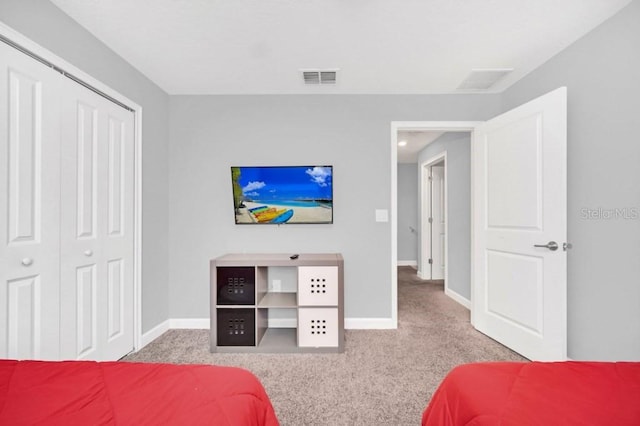 9017 Dogleg Dr, Davenport, FL 33896 - carpeted bedroom with a closet, visible vents, and baseboards