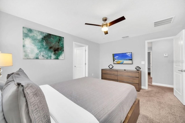 9017 Dogleg Dr, Davenport, FL 33896 - bedroom with visible vents, light colored carpet, a ceiling fan, and baseboards
