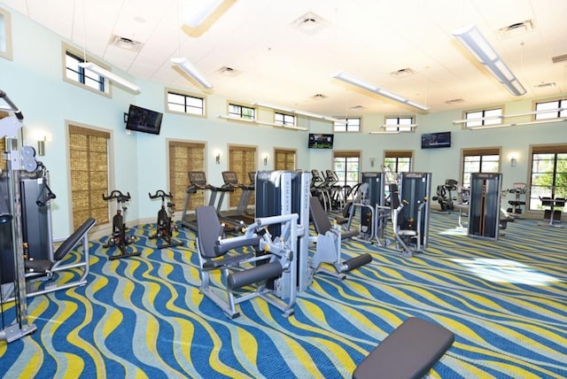 9017 Dogleg Dr, Davenport, FL 33896 - gym featuring carpet, visible vents, and a towering ceiling