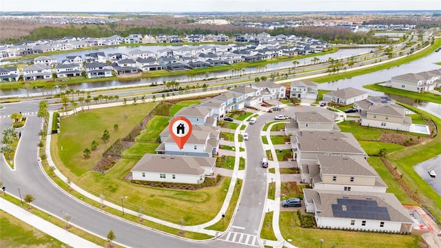 aerial view with a residential view and a water view