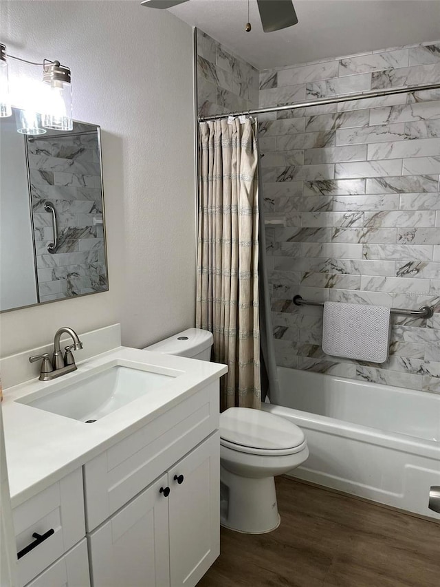 full bathroom featuring vanity, wood-type flooring, toilet, and shower / bath combo with shower curtain