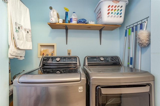 washroom featuring independent washer and dryer