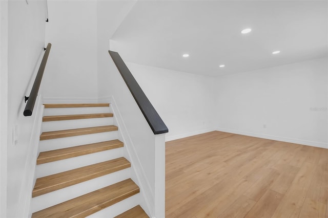 staircase featuring hardwood / wood-style flooring