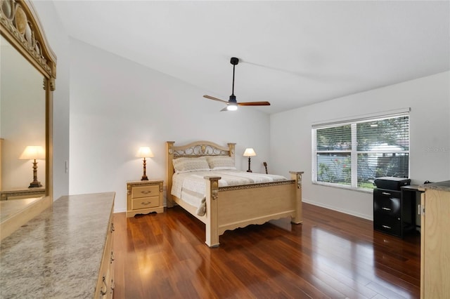 bedroom featuring baseboards, a ceiling fan, and wood finished floors