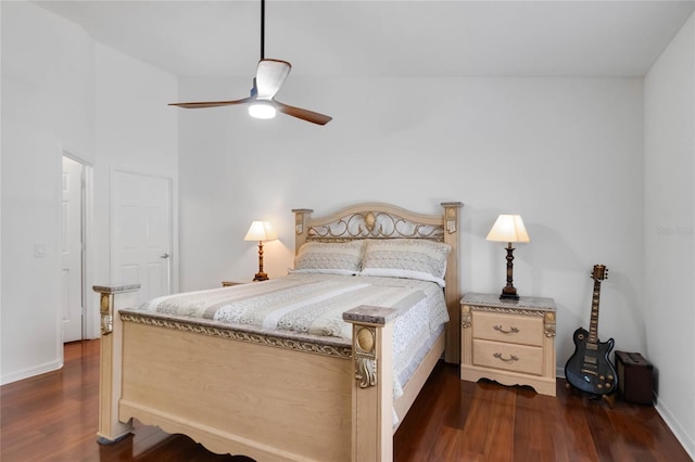 bedroom featuring dark wood finished floors, a ceiling fan, and baseboards