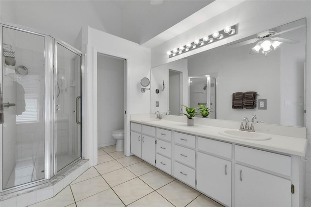 full bathroom featuring a stall shower, a sink, and tile patterned floors