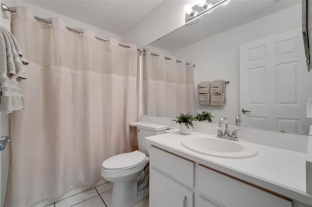 bathroom with a shower with shower curtain, vanity, toilet, and tile patterned floors