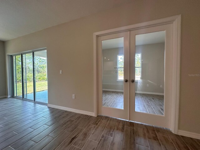 unfurnished room with french doors