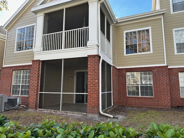 rear view of property featuring central air condition unit