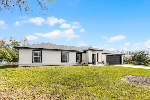 view of front of home with a garage and a front yard