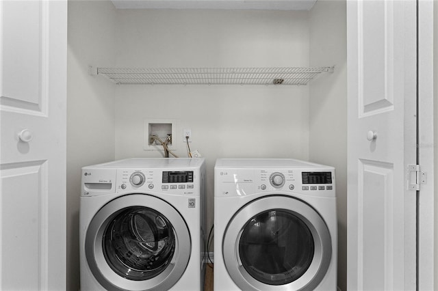 washroom with independent washer and dryer