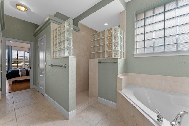 bathroom with tile patterned flooring and independent shower and bath