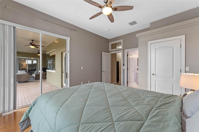 bedroom featuring ceiling fan and light hardwood / wood-style floors
