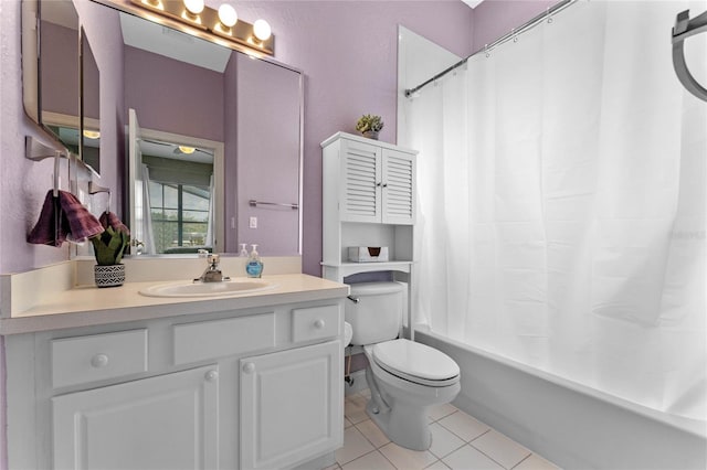 full bathroom with shower / bath combination with curtain, vanity, tile patterned floors, and toilet