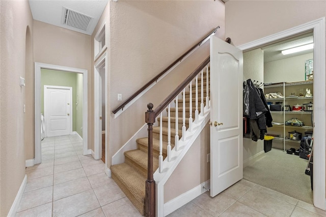 staircase with tile patterned flooring