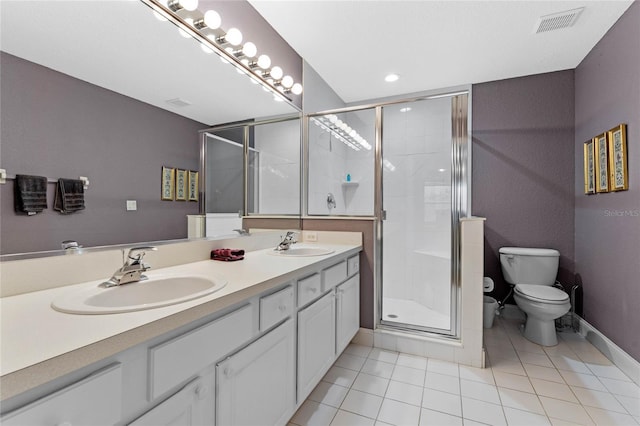 bathroom featuring walk in shower, tile patterned floors, toilet, and vanity