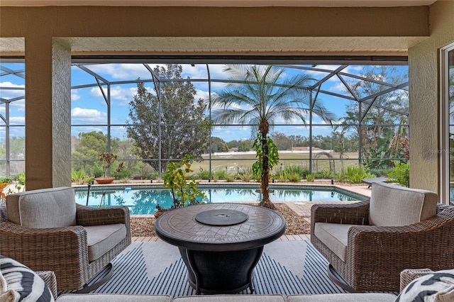 sunroom / solarium featuring a swimming pool and a healthy amount of sunlight